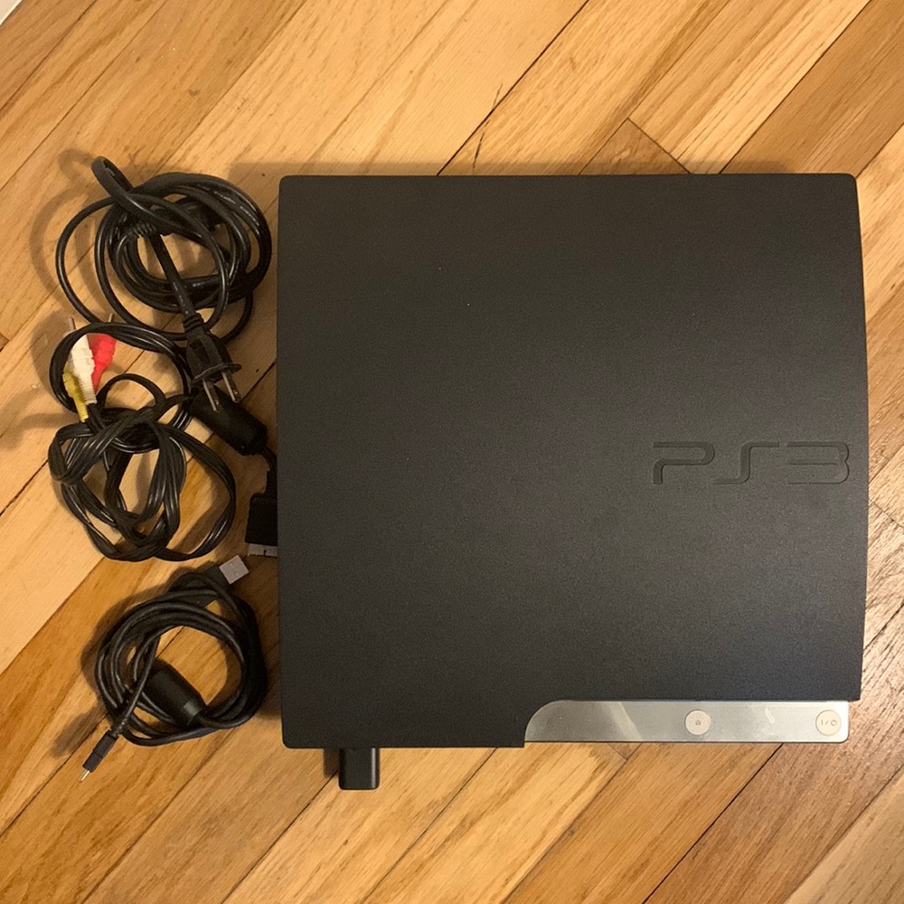 Play Station 3 with 4 controllers and charging station - hardly used